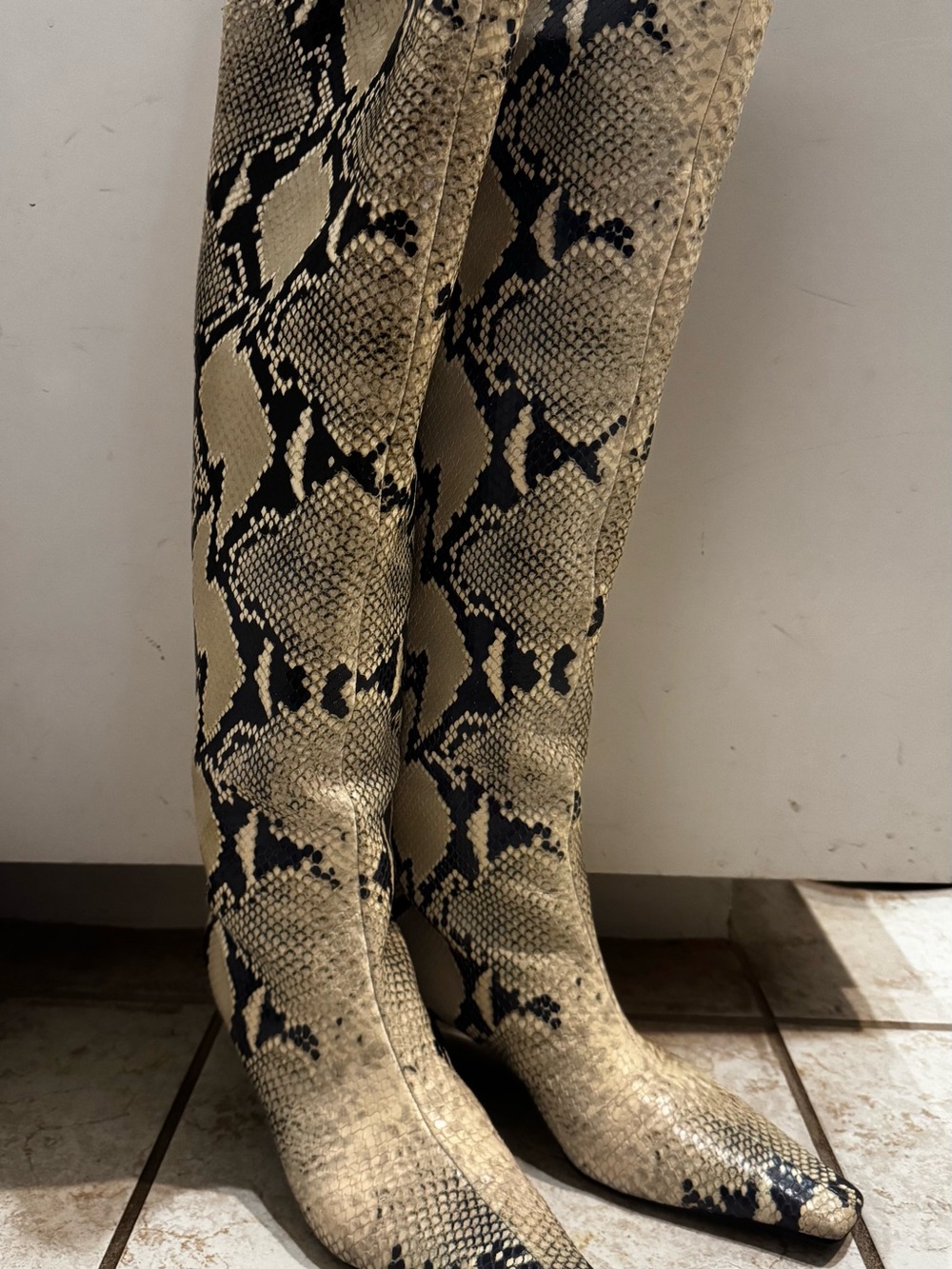 Khaite snakeskin heeled boots